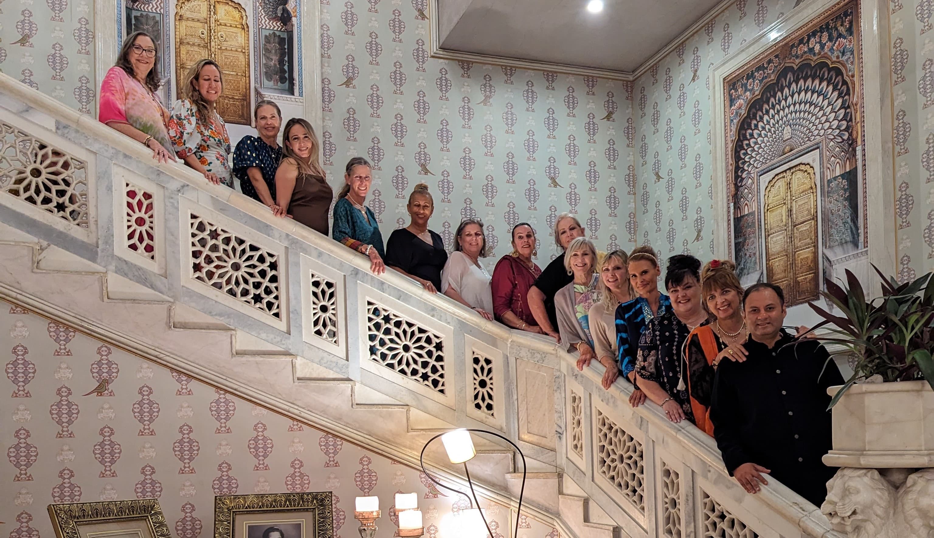 Guests gathered in a heritage palace stair hall